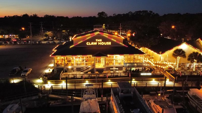Aerial view of The Claw House restaurant lit for Christmas on the MarshWalk