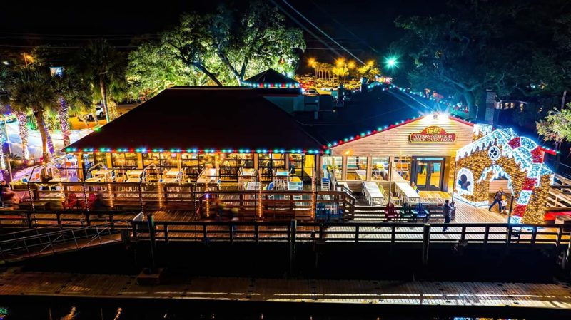 Restaurant patio outlined in multicolor lights